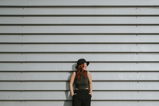 Woman leaning on wall