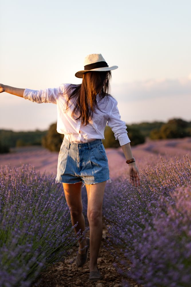 Woman walking in lavender field