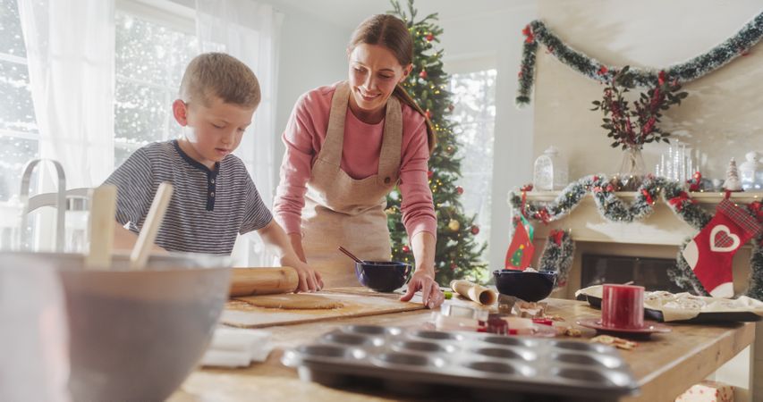 Portrait of Mother and Son Preparing for Baking Gingerbread on Christmas.