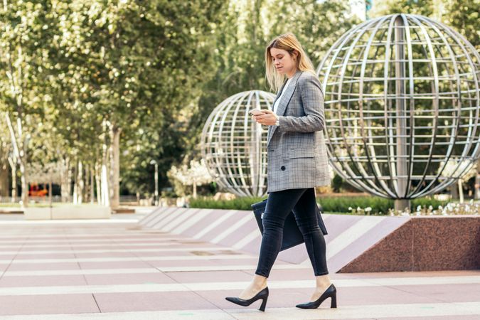 Businesswoman in a suit leaving the office
