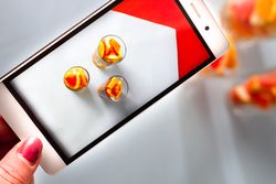 Photo of sliced citrus fruits on mobile phone