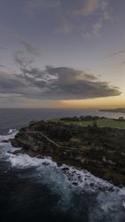 Landscape view of coastline at sunset