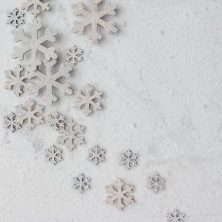 Winter pattern made of snowflakes on marble background