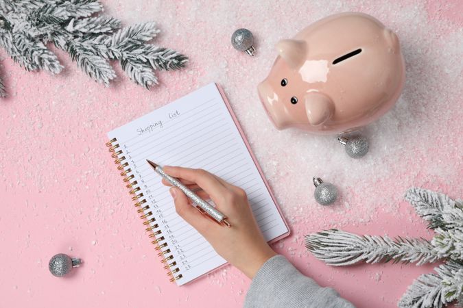 Concept of Christmas finance with piggy bank, top view