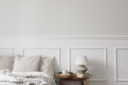 Bedside table with tray of coffee and lamp