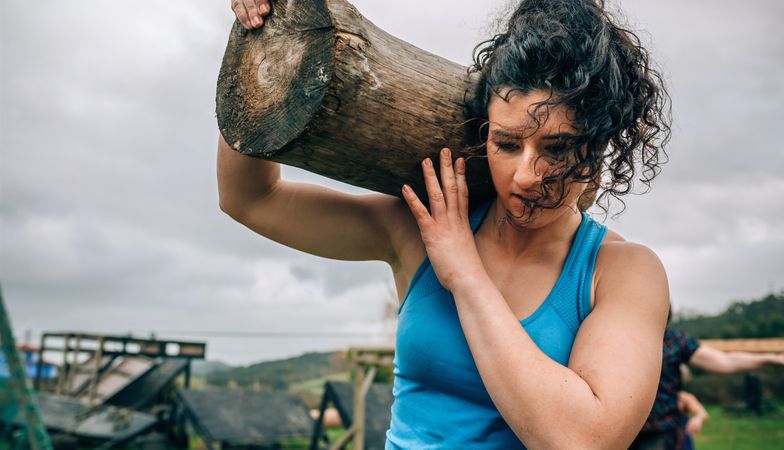 Woman carrying a trunk