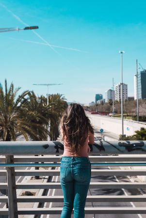 Teen girl walking happily through the streets.