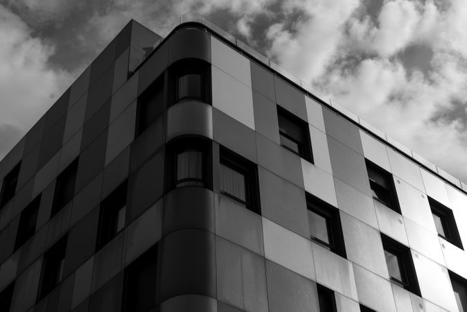 Facades of high buildings and cloudy sky