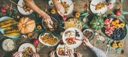Top view of Thanksgiving Day table with festive fall settings