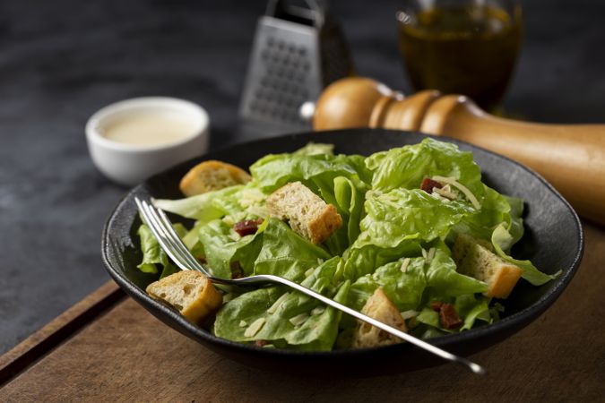 Caesar salad with croutons and bacon.