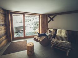 Female relaxing on rocking lounge chair