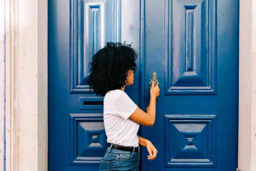 Stylish female by blue door