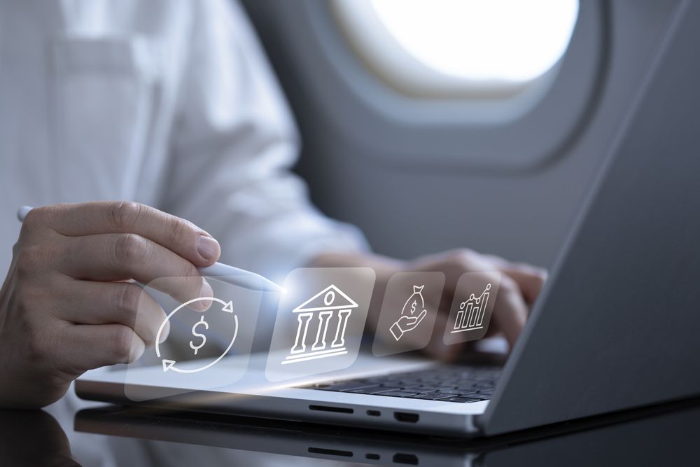 Businessman Analyzing Sales Data on Airplane