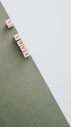 Inscription laid out with wooden cubes on contrasting surface