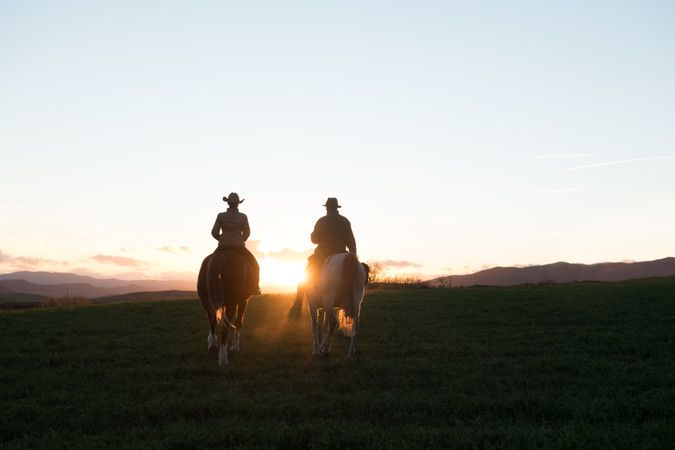 Man and woman riding horses