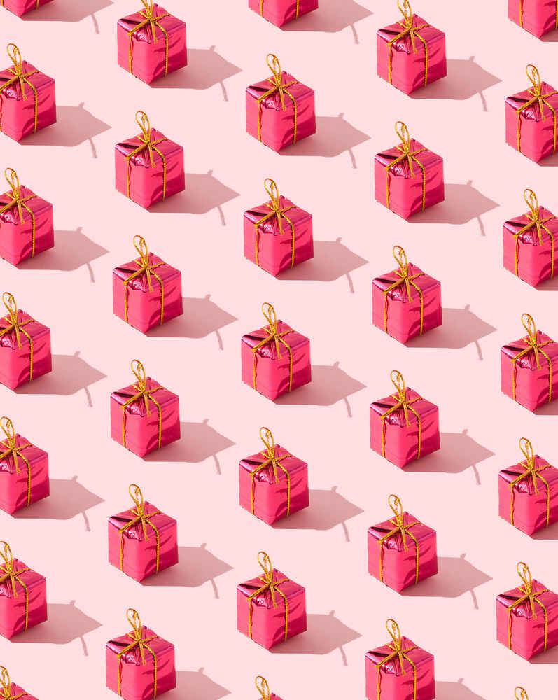 Close up of many red presents on pink background