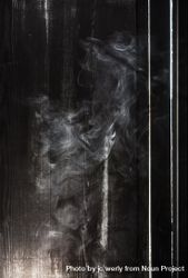 Smoke next to a wooden wall bYXAX4