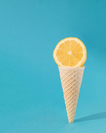 Waffle ice cream cone with slice of lemon