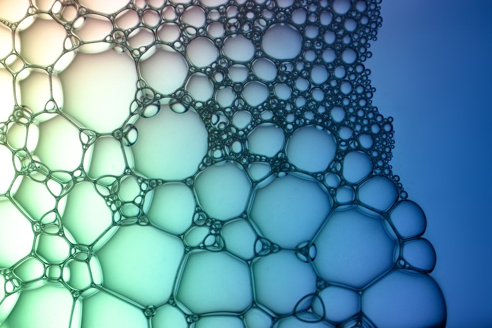 Abstract background bio technology, macro photography foam and water with gradient background. Molecule multicolor backgorund