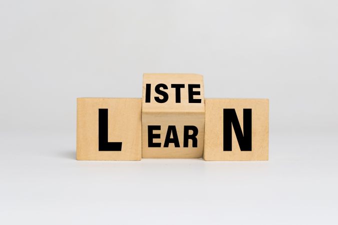 listen and learn words on turn wooden blocks isolated on light background
