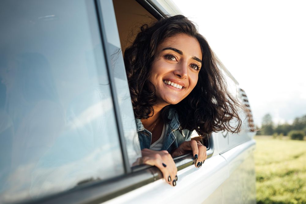 Young woman in camper van