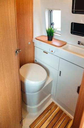 Motorhome toilet with plant, vertical