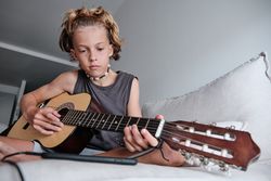 Child playing the guitar