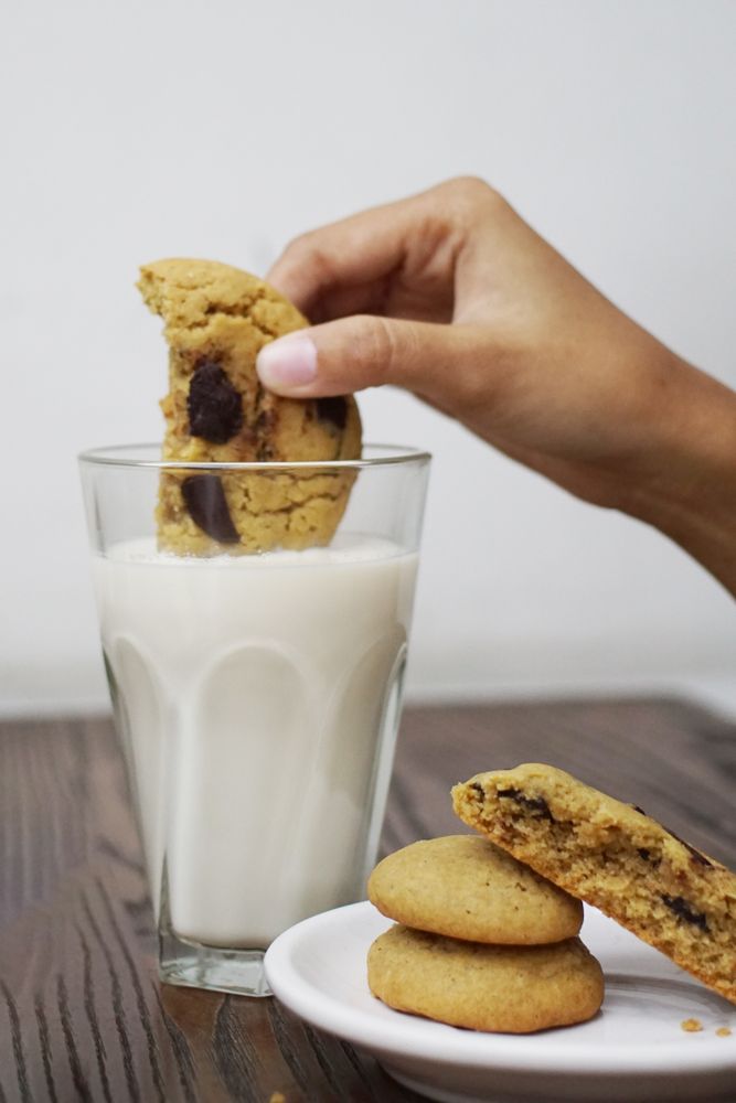 Dipping cookies in a glass of milk