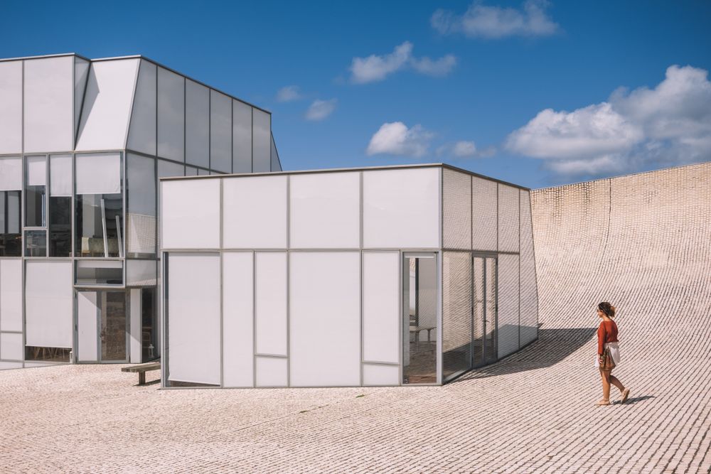Woman next to contemporary building