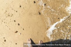 Shot of feet on the beach 5w9O9b