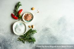 Rosemary with salt and pepper on marble counter 5ngW9M