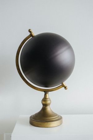Minimalist Globe on Gold Stand Still Life