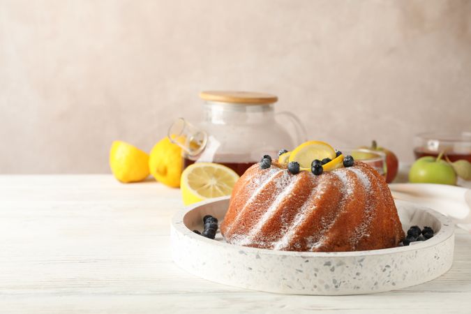 Cake with powder sugar and lemon, space for text