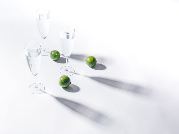 Creative composition of citrus and glasses of water