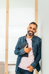 Portrait of a smiling  man in a coworking space