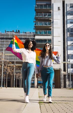 Female couple with LGBT flag