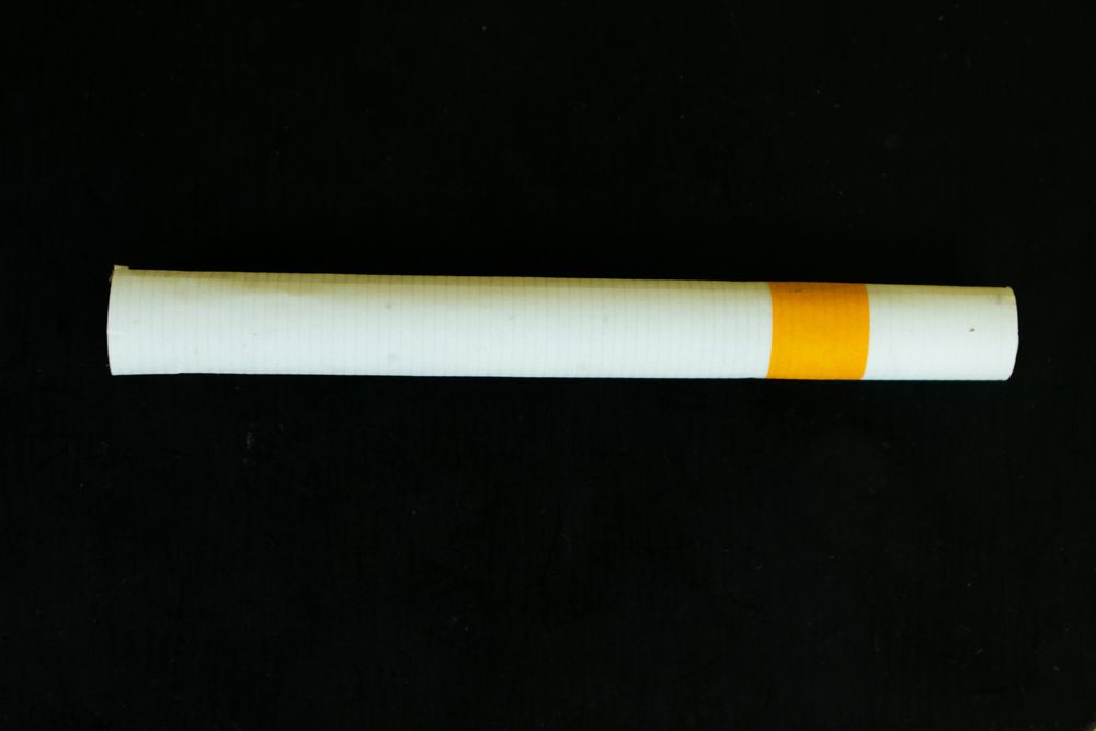 Cigarette on dark background