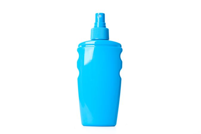 Sunscreen spray isolated on plain background. Summer vacation accessories