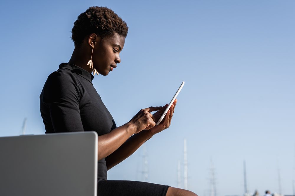 Serious female using mobile phone