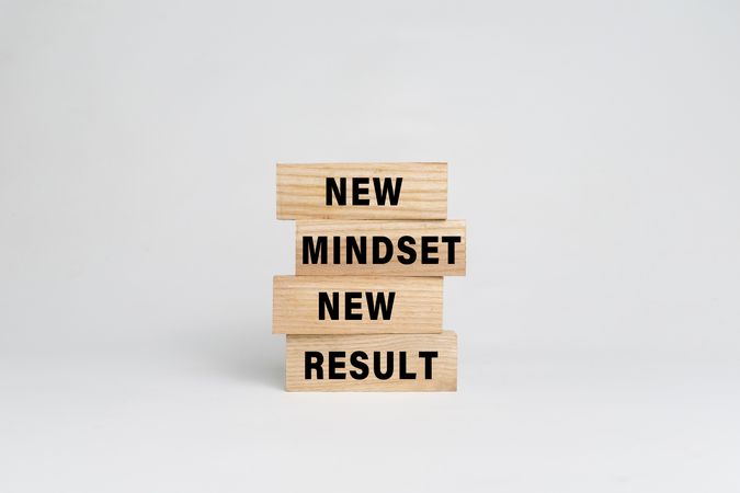 new mindset new result words text on wooden blocks
