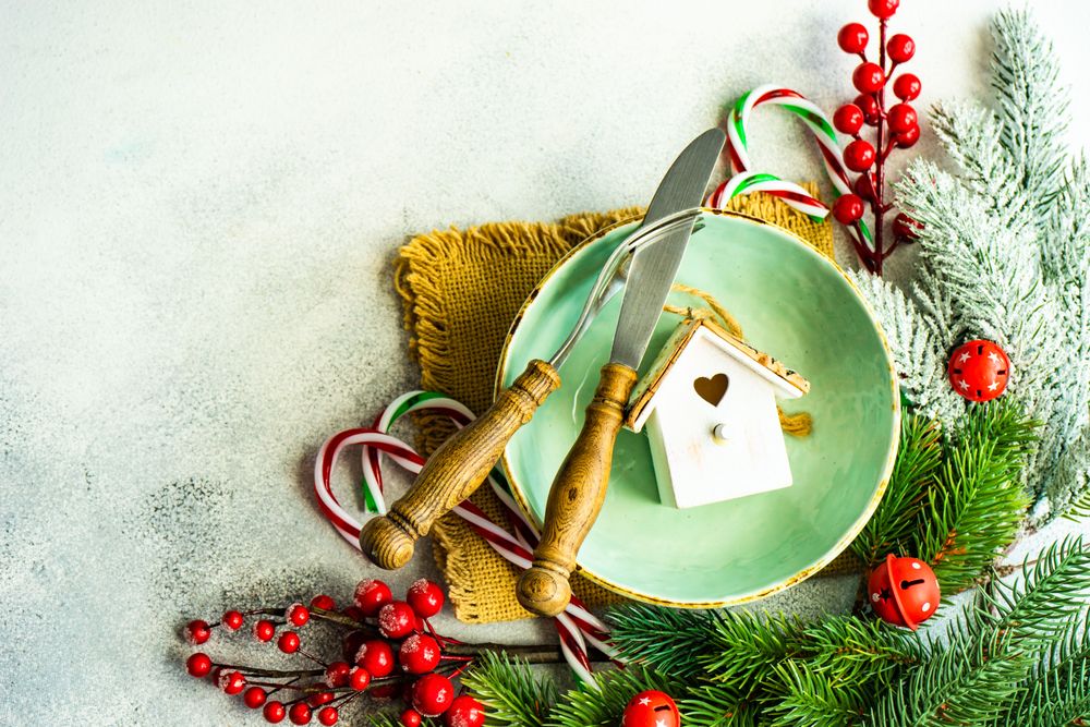 Top view of bird house ornament in green table setting