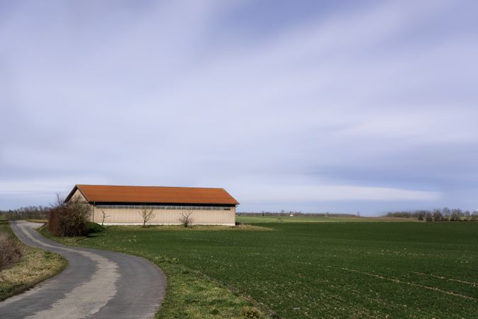 Rural scene with farm building and agricultural fields