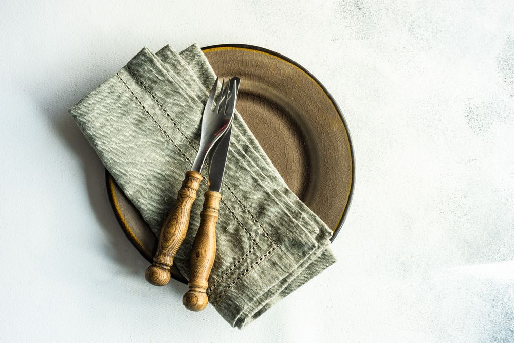 Top view of rustic table setting on marble table
