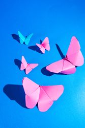 Paper butterflies on silk cloth