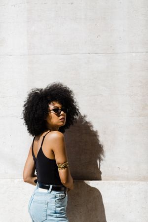 Cheerful Black female in dark sunglasses