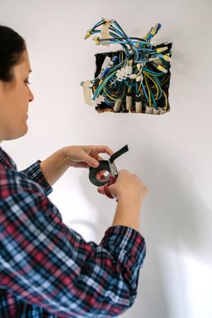 Electrician working on the electrical installation of a house