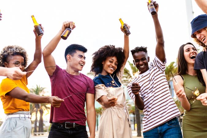 Group of happy adult having fun at summer party with beer