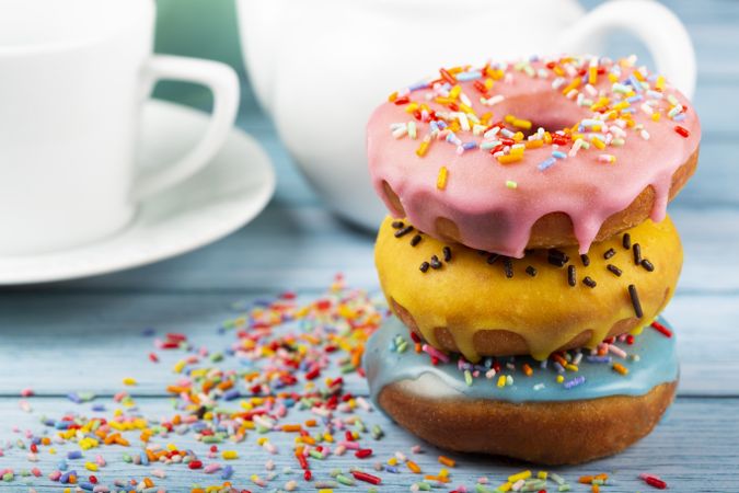 Delicious assorted colorful donuts on the table.