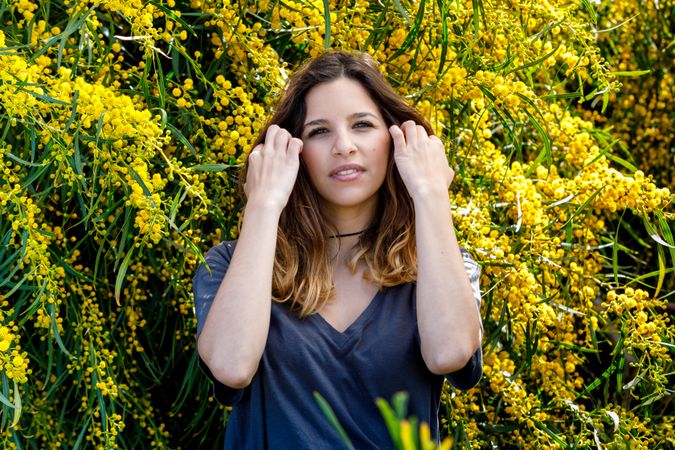 Young female near blooming bushes