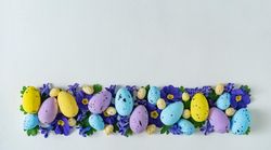 Easter eggs and purple flowers and leaves